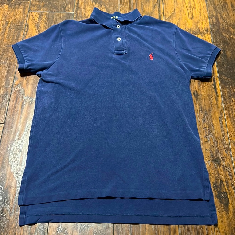 Navy blue Polo shirt by Ralph Lauren. No flaws.